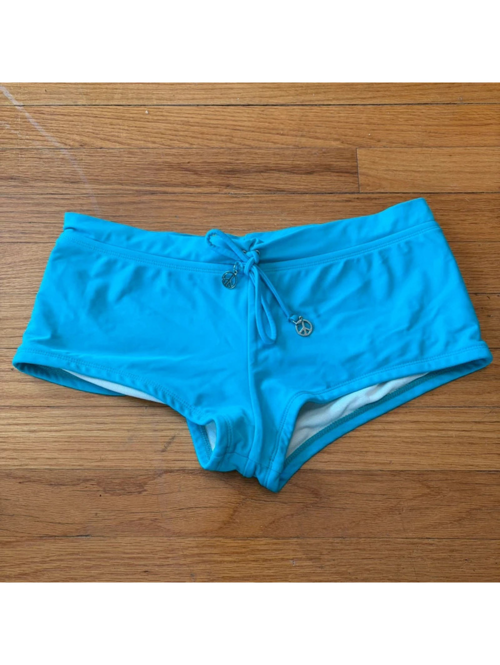 Vintage y2k teal peace sign mini shorts